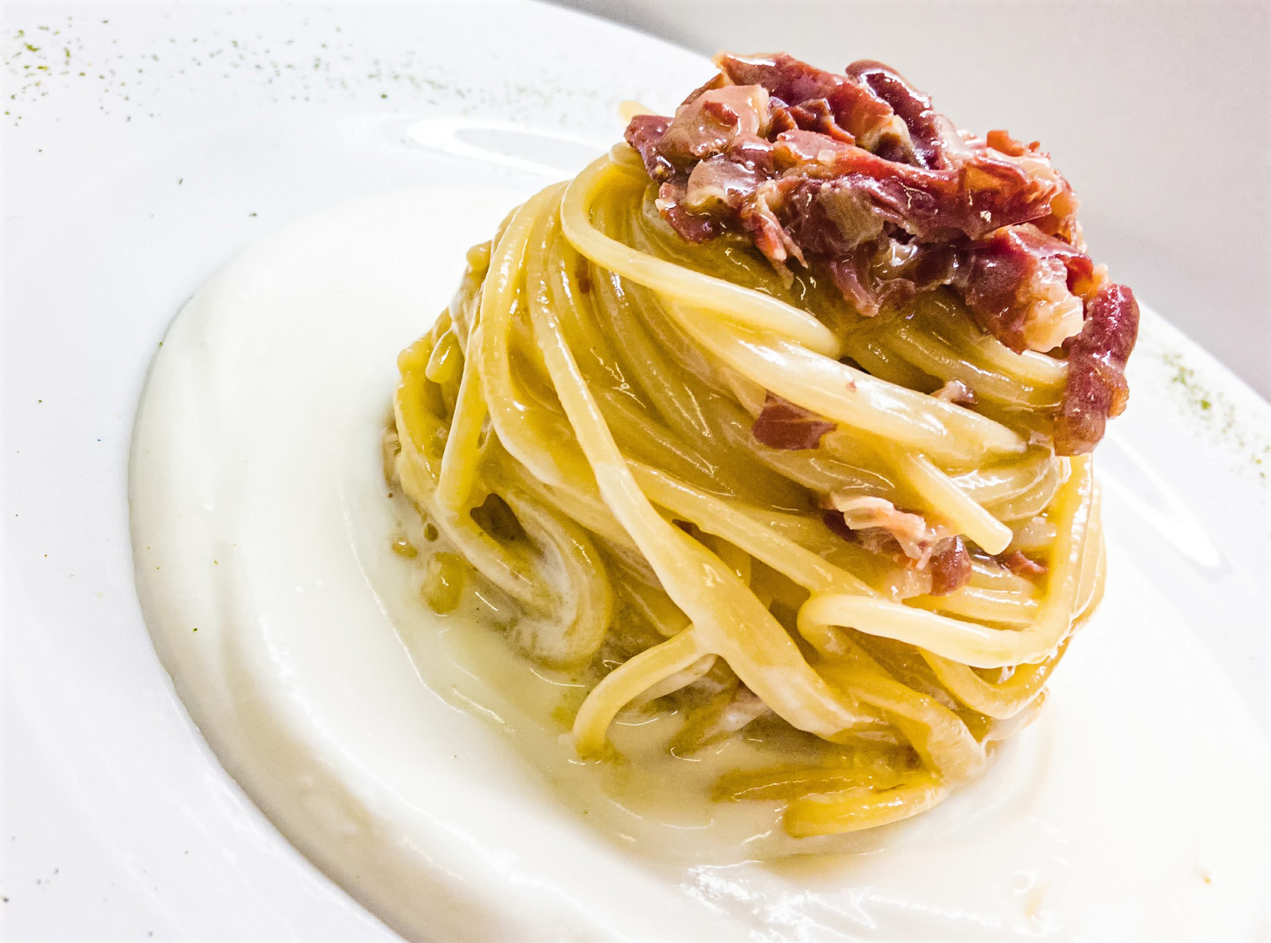 Spaghetti al Prosciutto di Parma e Parmigiano su Crema di Ricotta